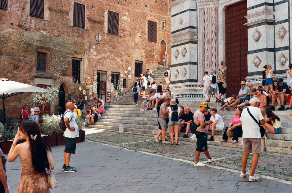 The stepped facade of Todi's Duomo overlooking Piazza del Popolo