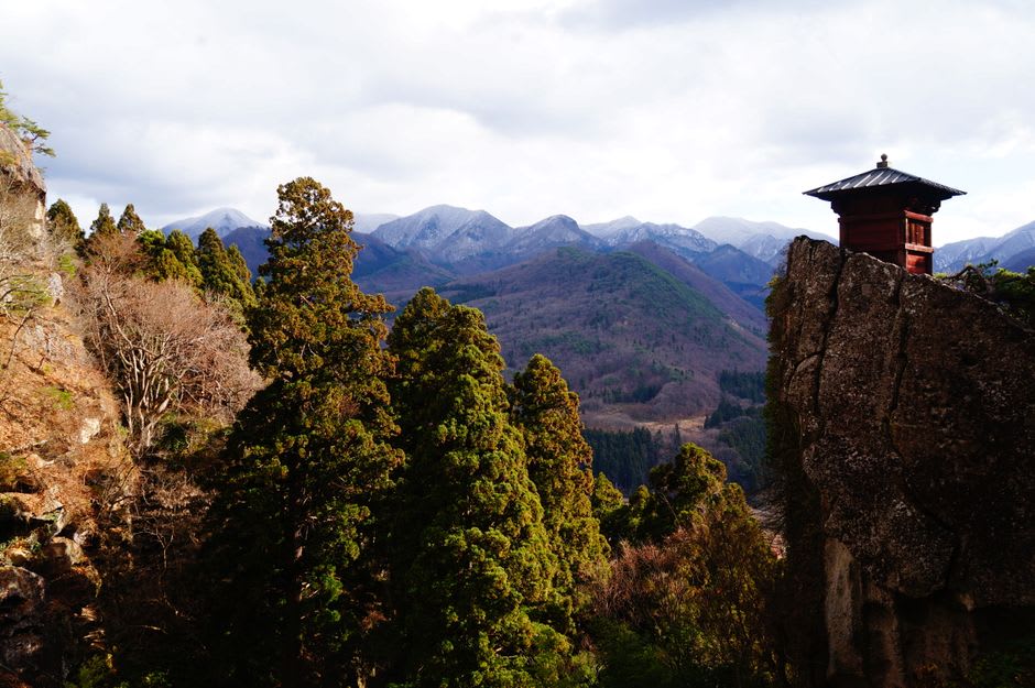 The mossy stone approach to Daisen-ji temple beneath towering cedars
