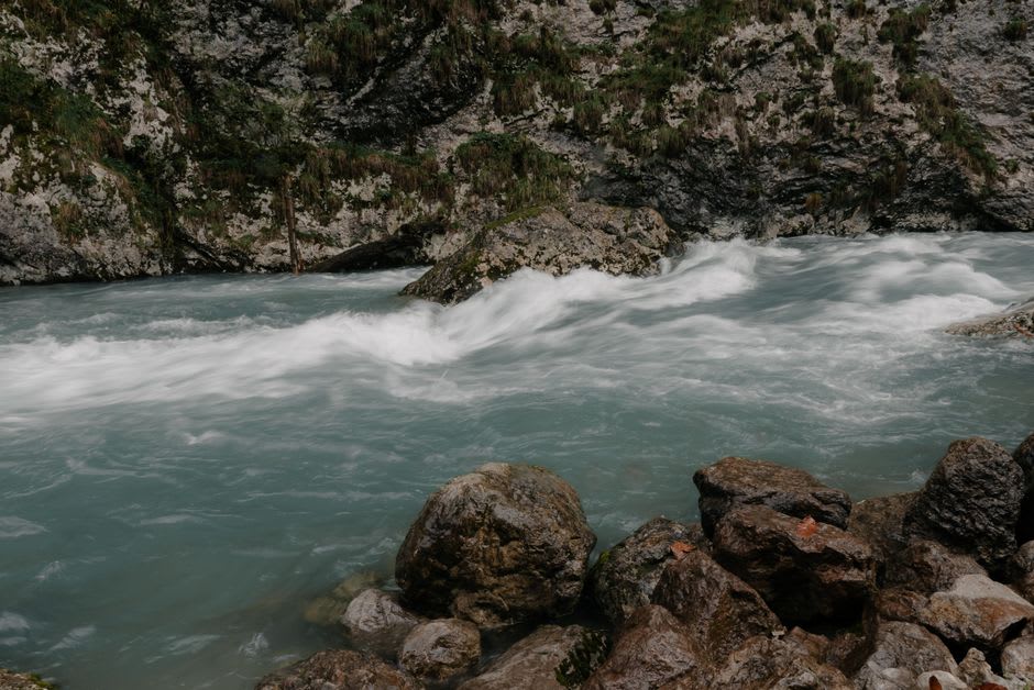 The Iwai River hammering through rock cauldrons in a froth of white water at Genbikei