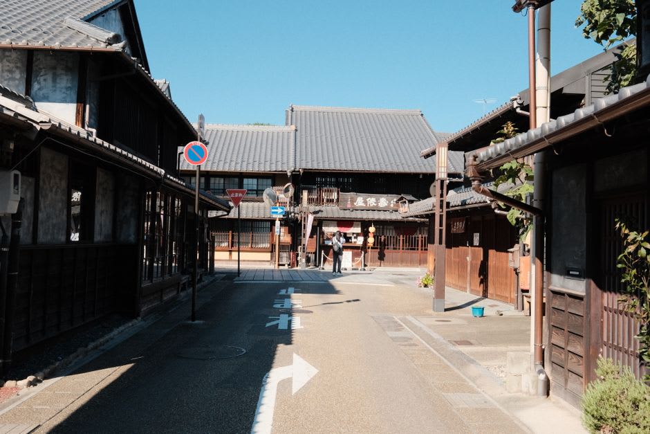 A quiet lane in the Meiji-mura open-air museum lined with preserved Meiji-era brick buildings