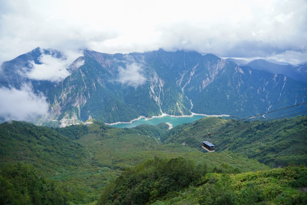 The pale turquoise Hime River flowing between forested alpine slopes above Itoigawa