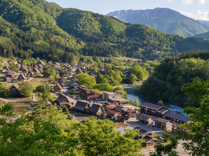 A thatched-roof farmhouse with an irori hearth in the misty Iya Valley