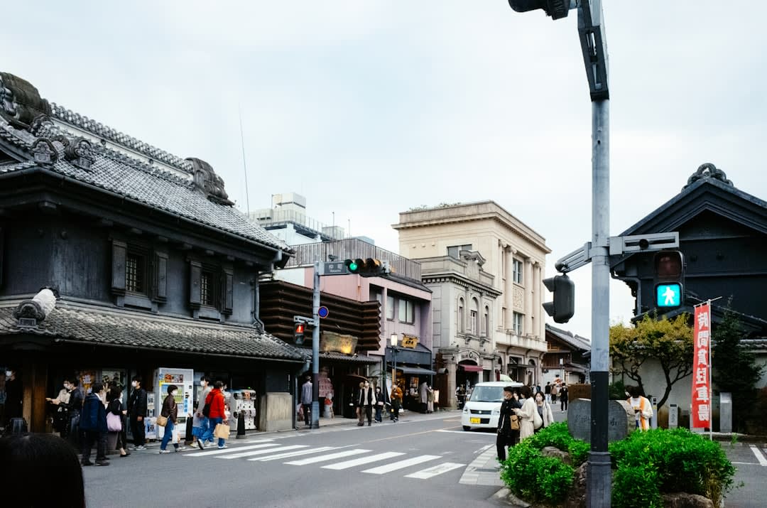The cobbled lane of Kashiya Yokochō in Kawagoe lined with old-fashioned candy shops, jars of colourful sweets and hanging snacks