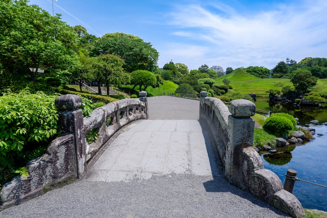 The strolling garden of Suizen-ji, its clear pond ringed by clipped lawns and a small grassy cone representing Mount Fuji