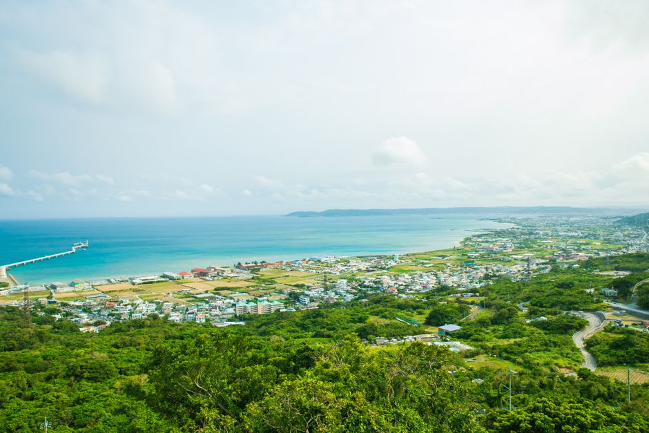 The white arc of Yonaha Maehama beach meeting pale turquoise shallows on Miyakojima