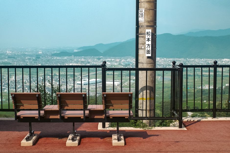 Terraced green rice paddies and a roadside milk stand in the valleys around Miyama