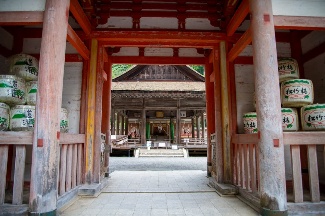 Dark wooden halls of Enryaku-ji temple among tall cedars on Mount Hiei above Otsu