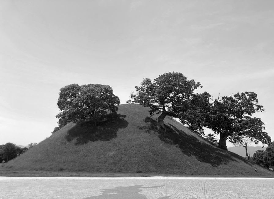 The moat and forested edge of the keyhole-shaped Nintoku kofun burial mound in Sakai