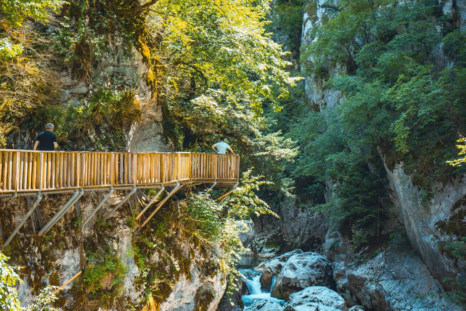 The forest trail winding along the cliff above the river in Sandankyo