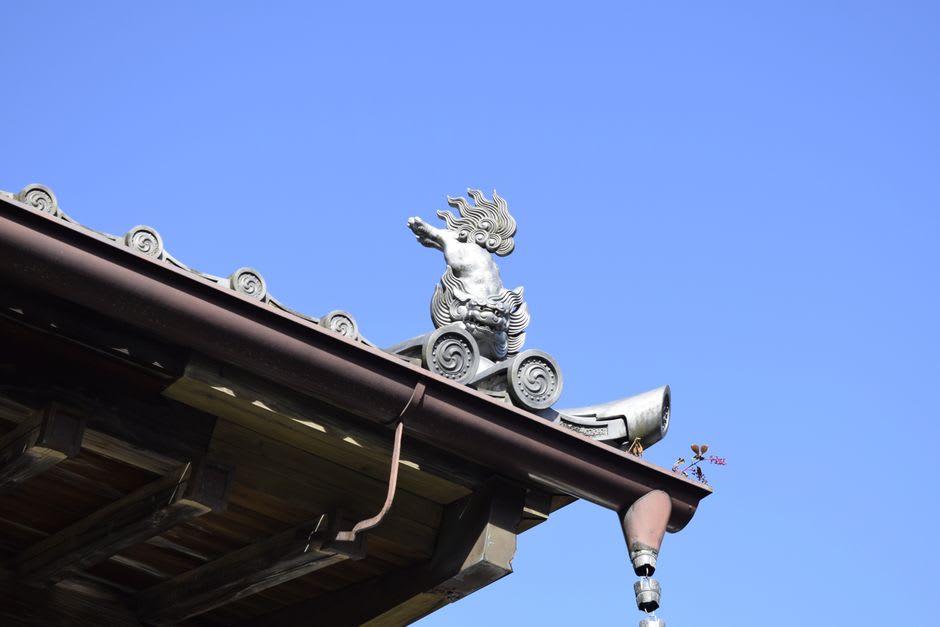 The bronze statue of Date Masamune on horseback at the Aoba Castle ruins in Sendai, the green city spreading across the plain far below