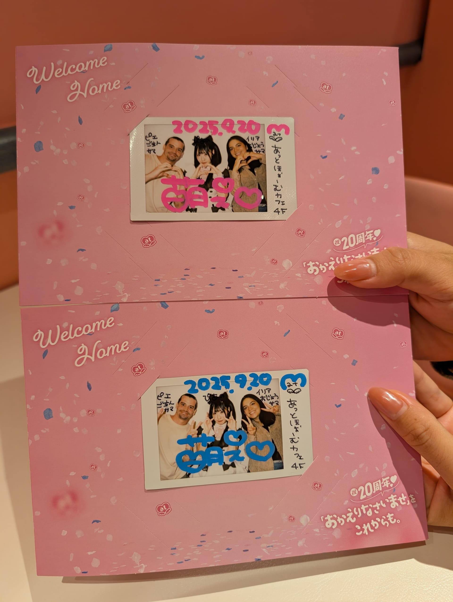 Welcome Home polaroid cards from the maid cafe — pink borders, group photos with maids, hearts and stars drawn in marker