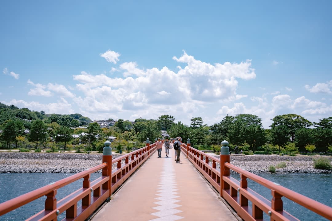 The Phoenix Hall of Byōdō-in seen across its reflecting pond, the wooden structure and its mirror image forming the shape of a bird