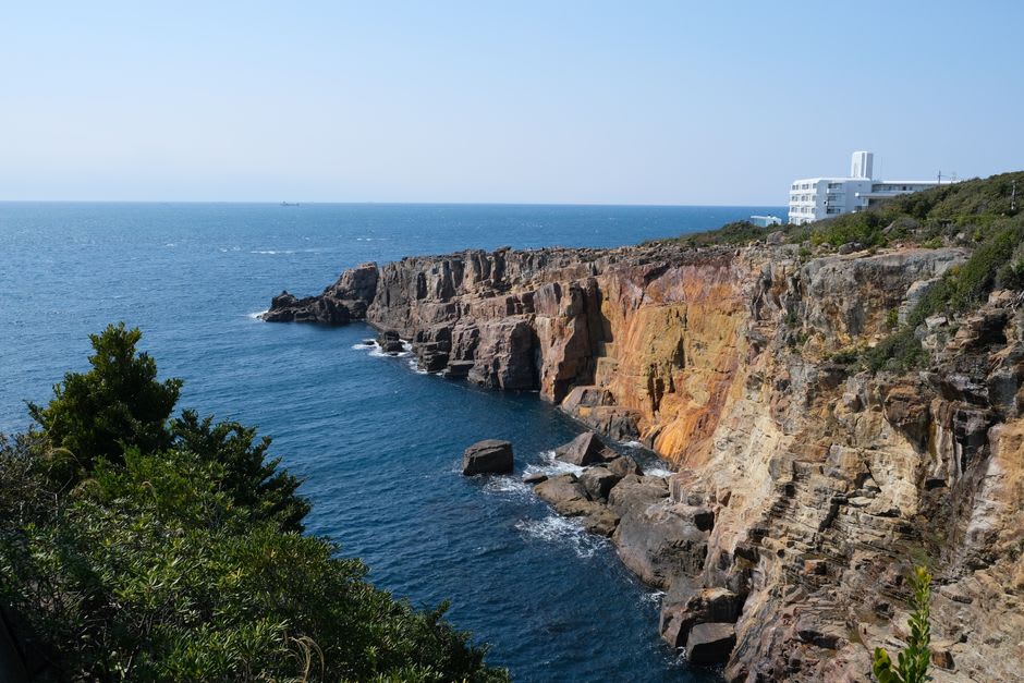 Fishing boats in Wakayama harbour with the Kii coast stretching south under a wide sky