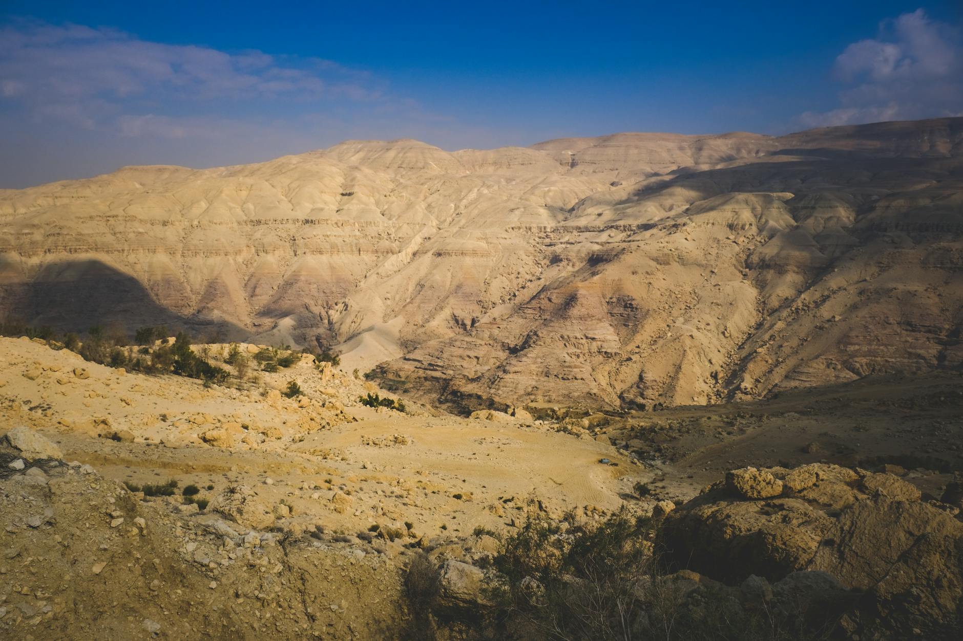 Sunset over the dramatic desert canyon landscape of the Dana Nature Reserve