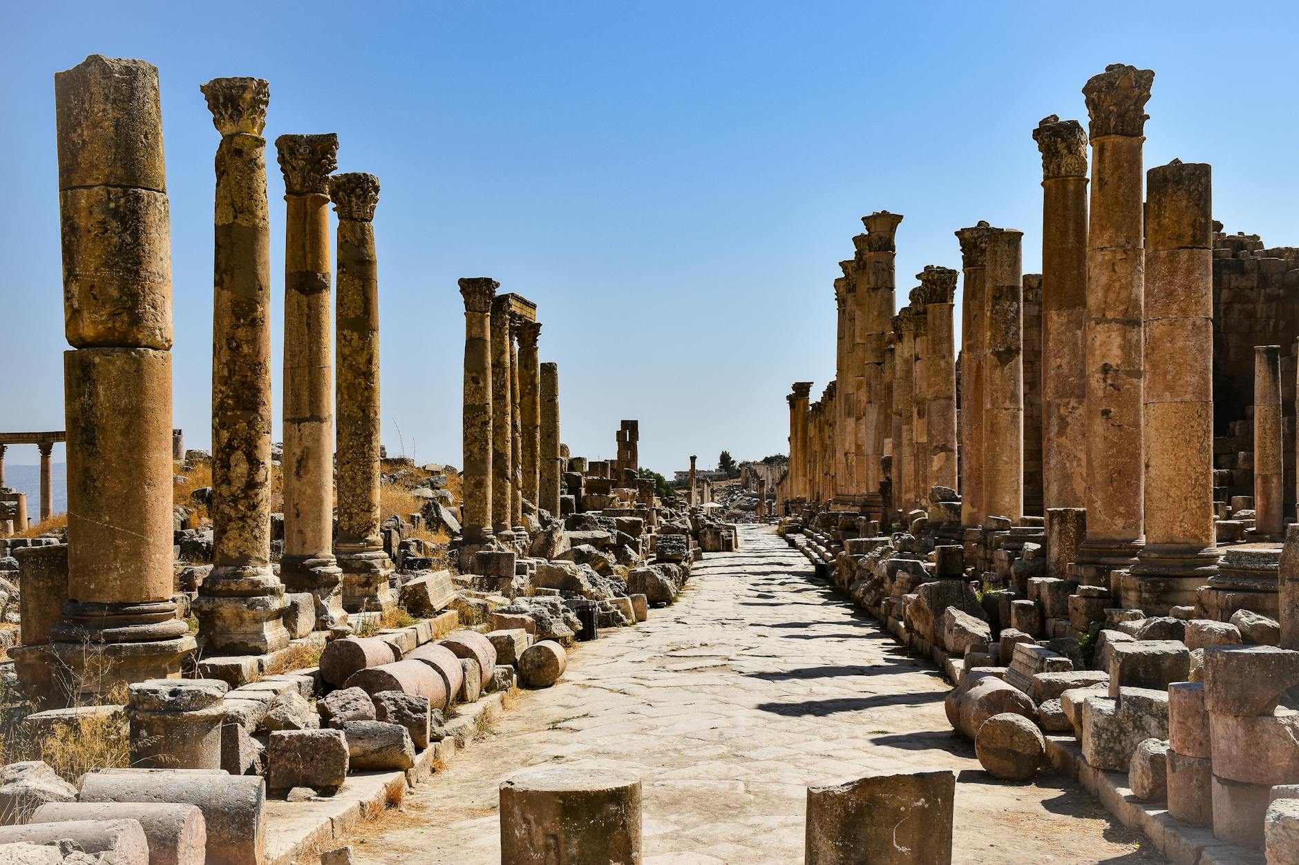 Ancient Roman columns of the Oval Plaza at Jerash in golden light