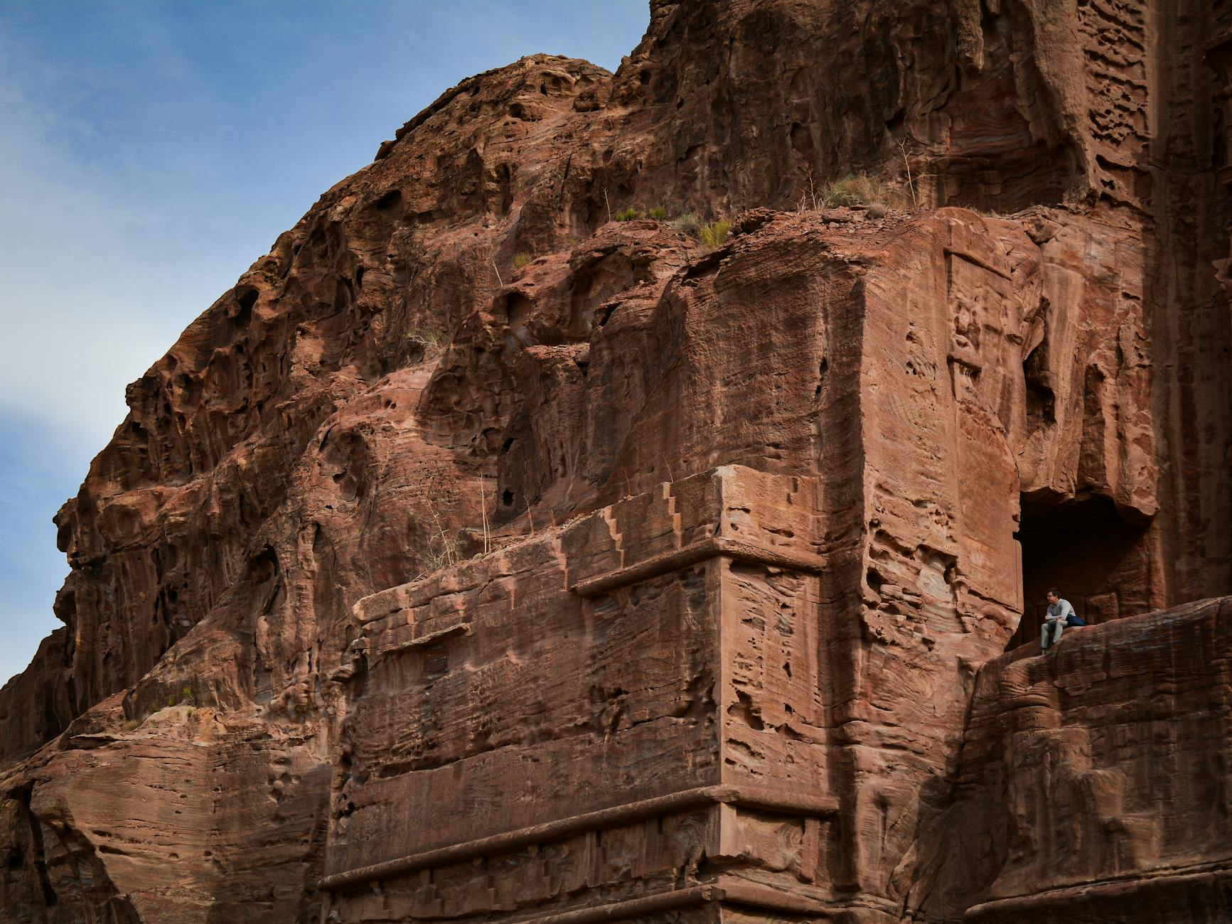The rose-red facade of the Treasury emerging from the narrow Siq canyon