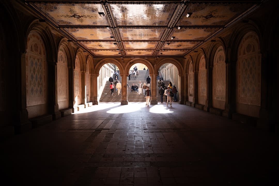Stone archways on the upper terrace of Pari Mahal glowing gold in the late afternoon light