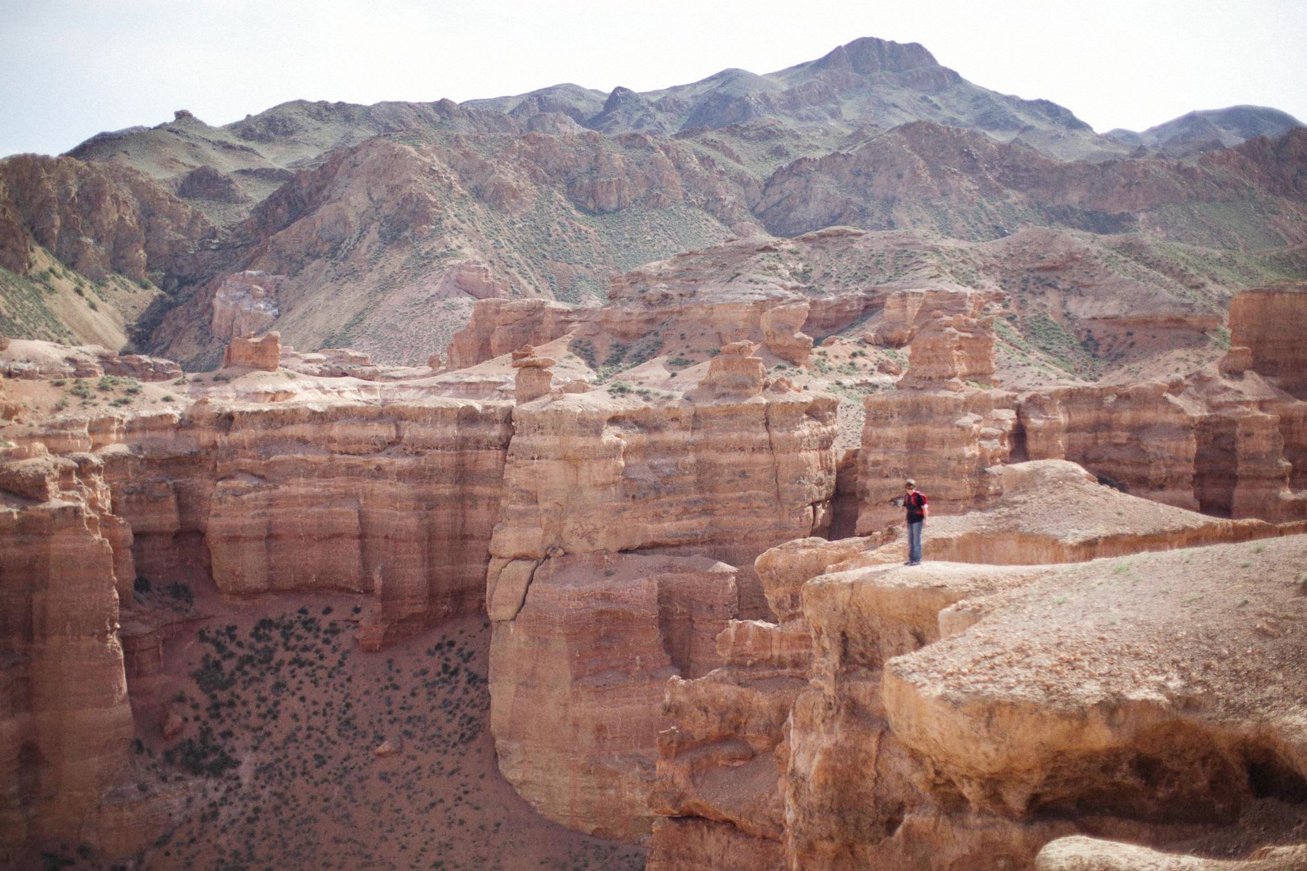 The Valley of Castles at Charyn Canyon with its wind-sculpted rust towers catching the late afternoon light