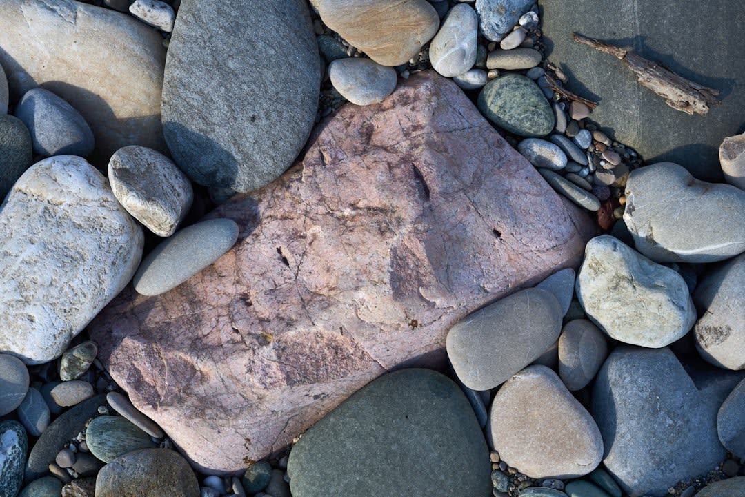 Close-up detail of the weathered granite texture at Hin Ta Hin Yai near the seafood stalls