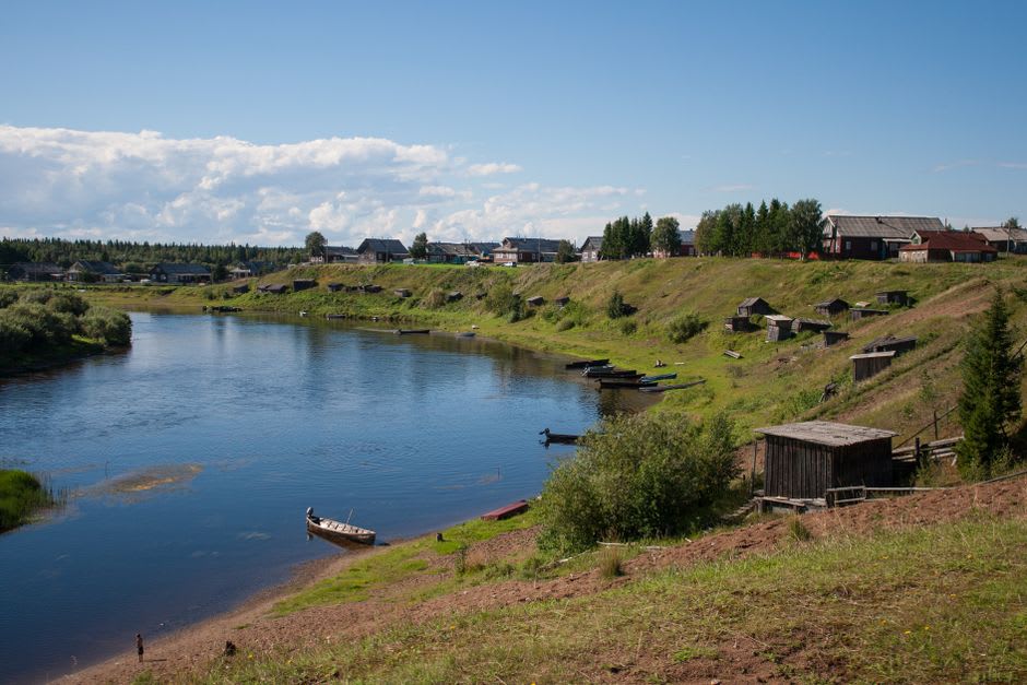 A local fisherman's wooden hut and drying nets along the Chivyrkuisky Bay shoreline