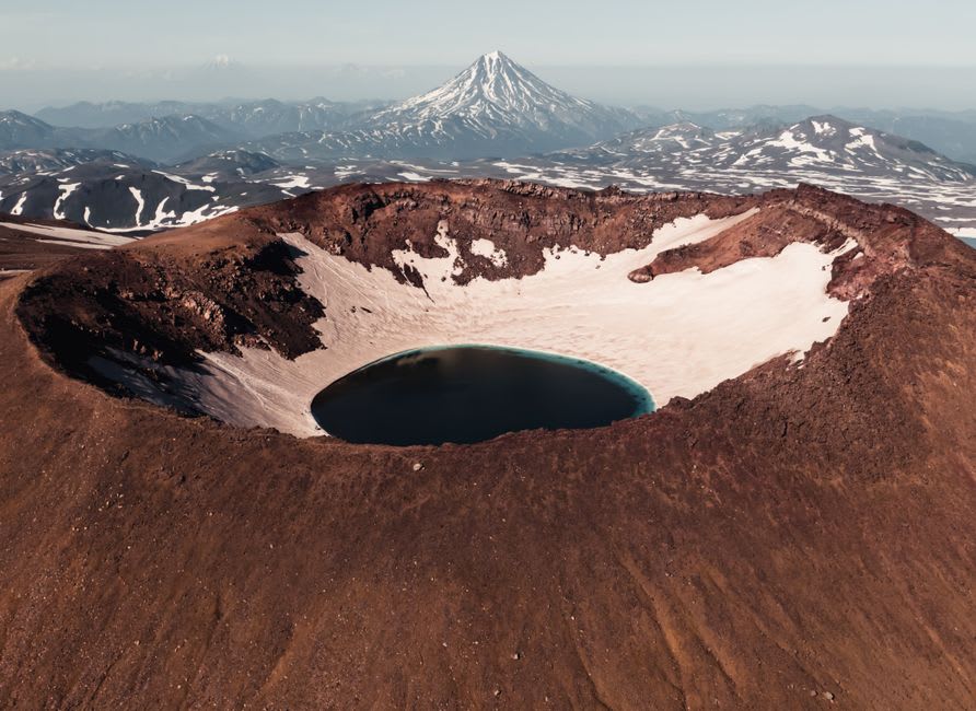 The extinct crater lake of Volcán Apagado seen from a mossy overlook in Parque Nacional Hornopirén