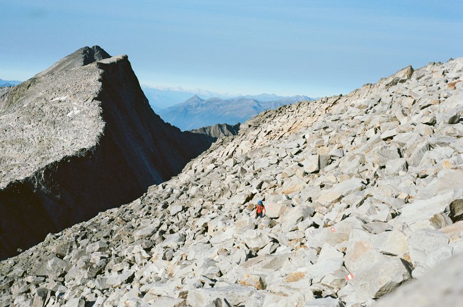 Climbers ascending the boulder field near the summit of Scafell Pike