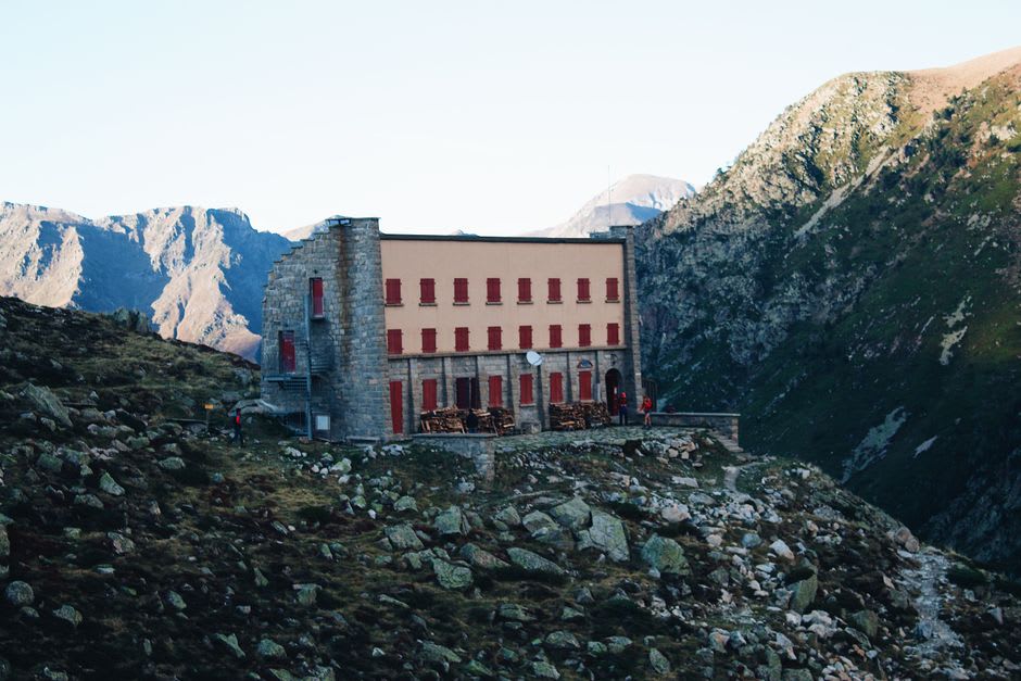 The stone building of Sani Mountain Lodge at Sani Top with the Maluti peaks behind it