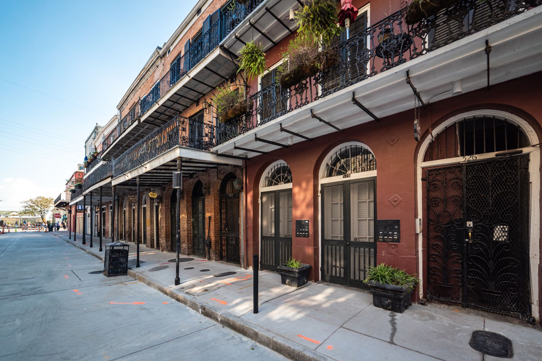 Wrought-iron balconies draped in ferns along Royal Street in the French Quarter