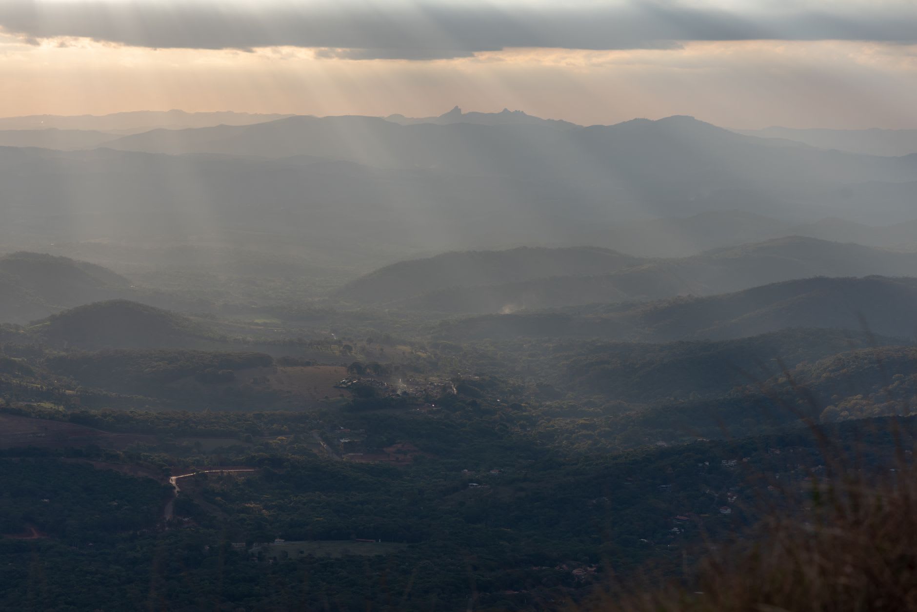 A viewpoint on the Zomba Plateau edge, looking out over the plains and the distant blue line of Lake Chilwa