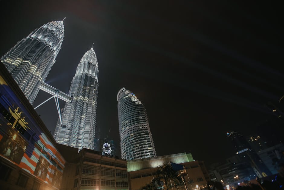 The Petronas Twin Towers glowing against the KL skyline at dusk