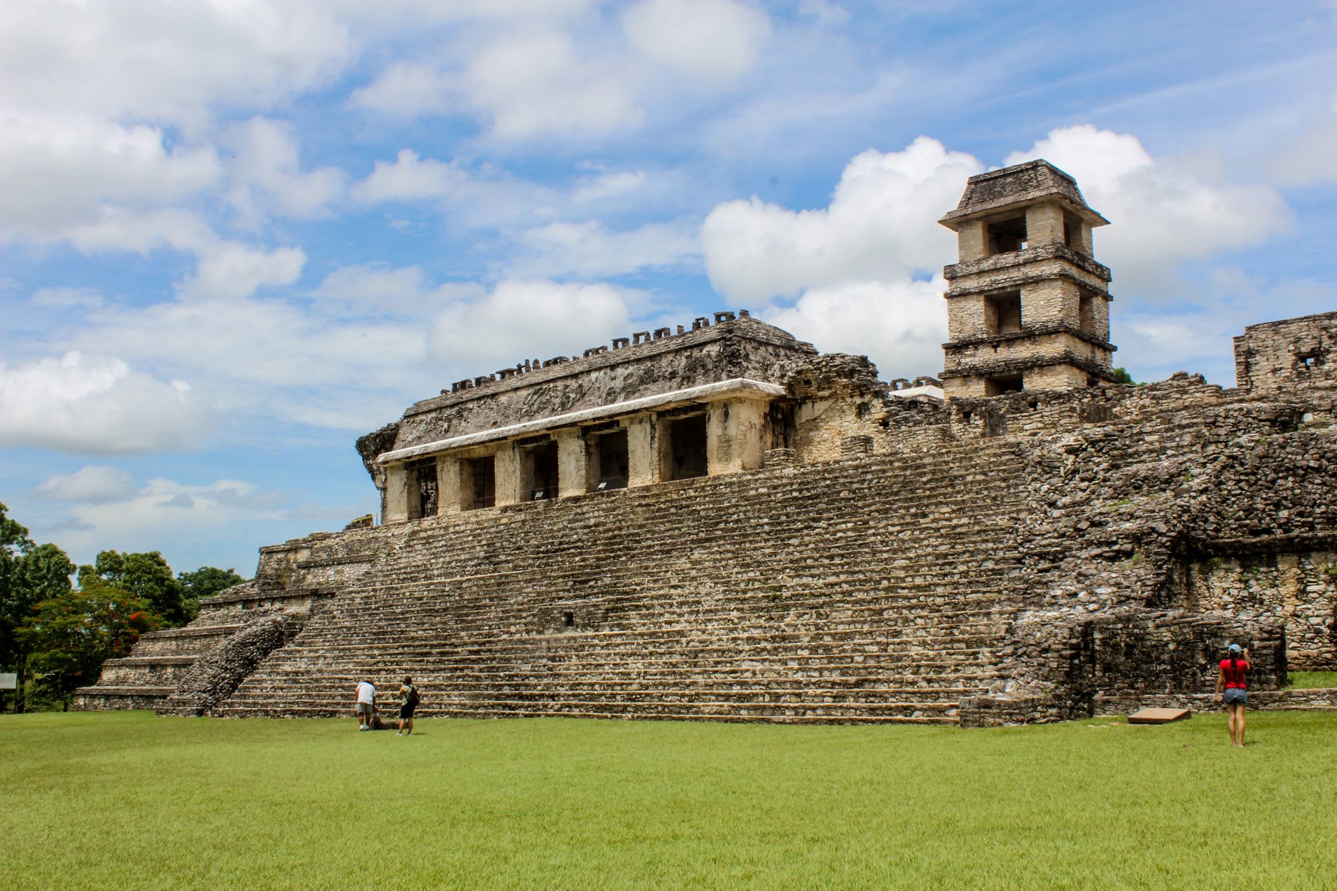 The restored stucco frieze on El Castillo at Xunantunich, astronomical figures and masks in relief visible in afternoon light