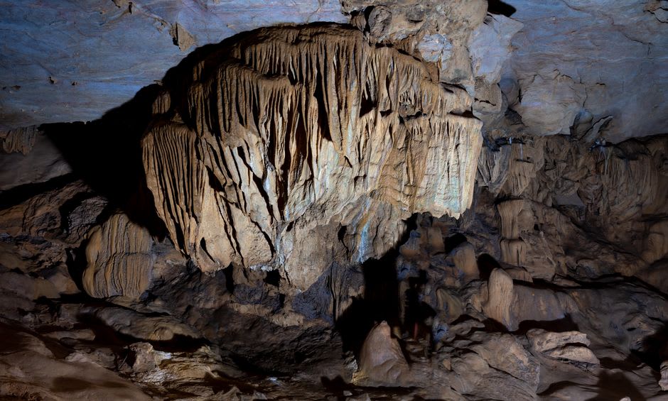 Women weaving jipi hats in an underground cave in Becal