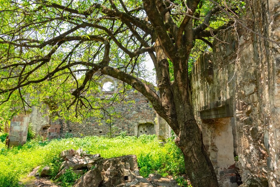 The austere stone facade of the sixteenth-century Augustinian convent at Charo, its weathered walls rising plainly above the quiet town