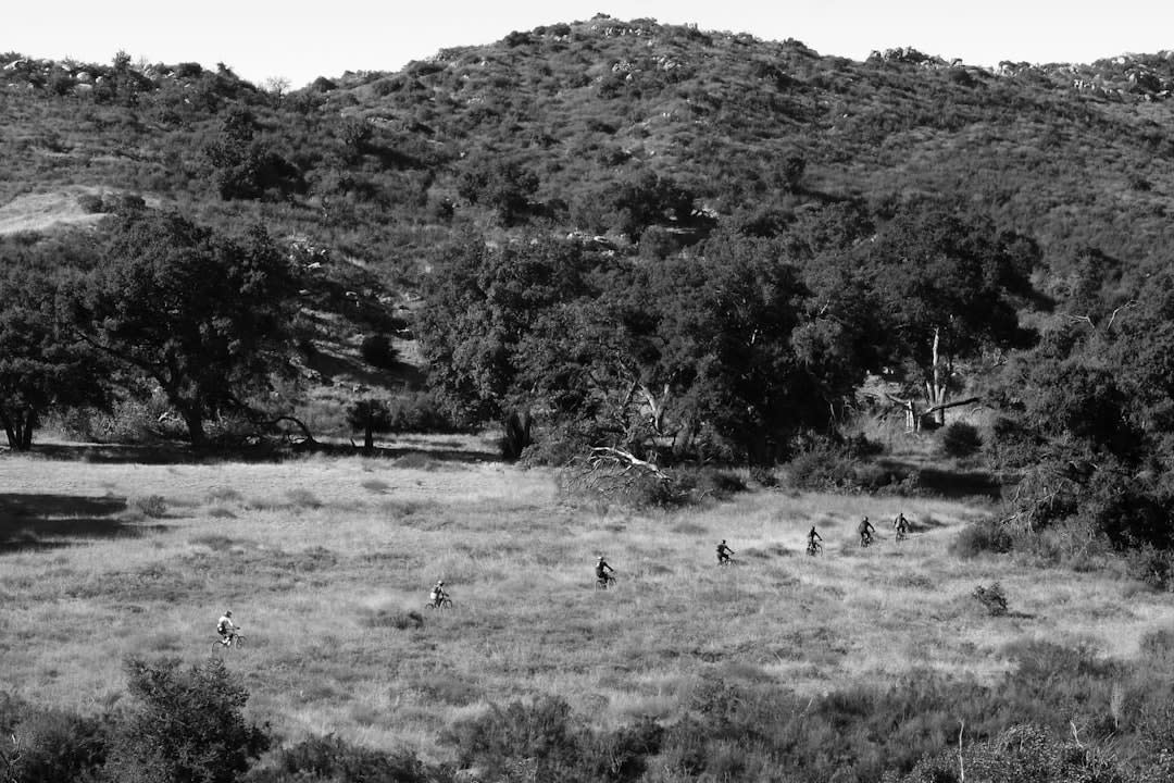 Ranchero on horseback riding the dirt path between San José and San Miguel de comondu, canyon walls in the background