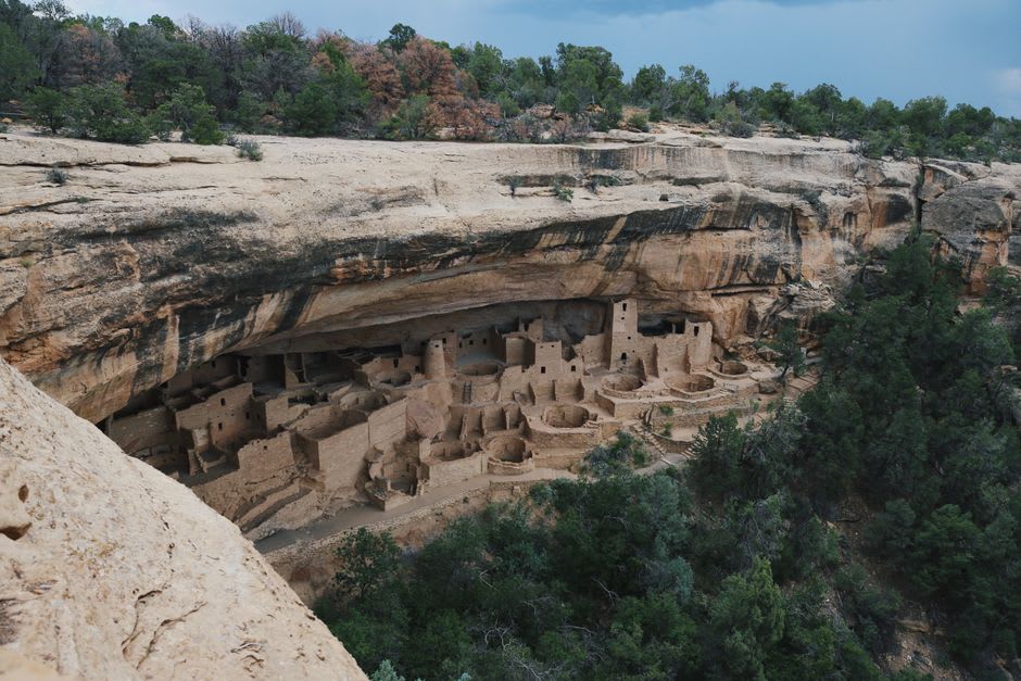 Cliff dwellings of Cuarenta Casas set into their natural alcove high above the canyon floor