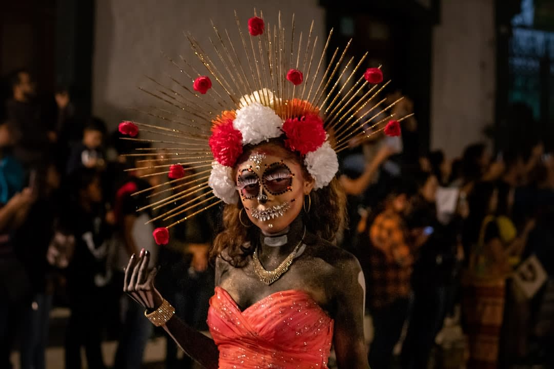 The Juchitán market stalls at Tuesday morning, Zapotec women in traditional huipil dresses selling dried shrimp and seafood from the Tehuantepec lagoons, the flower and gold jewelry headdresses of the formal dress visible on several vendors