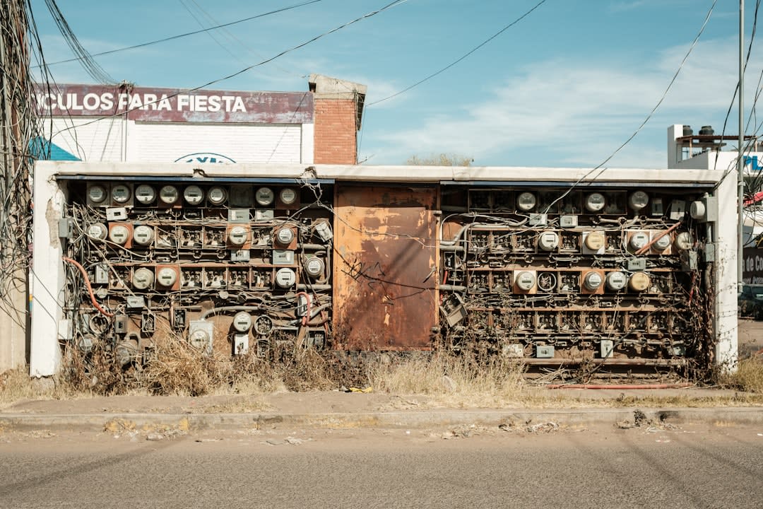 Street scene along Calle Obregón in Nogales, Sonora, with pedestrians and storefronts visible in afternoon light