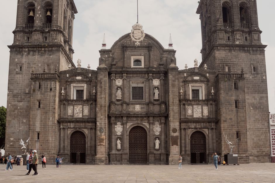 The terracotta baroque facade of the Parroquia de la Inmaculada Concepción in Ocotlán's central plaza