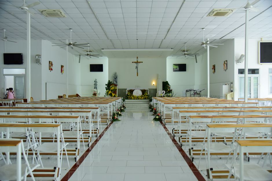 The side walls of the Petatlán sanctuary covered floor to ceiling with gold ex-voto tablets, arranged in dense overlapping rows extending to the vault