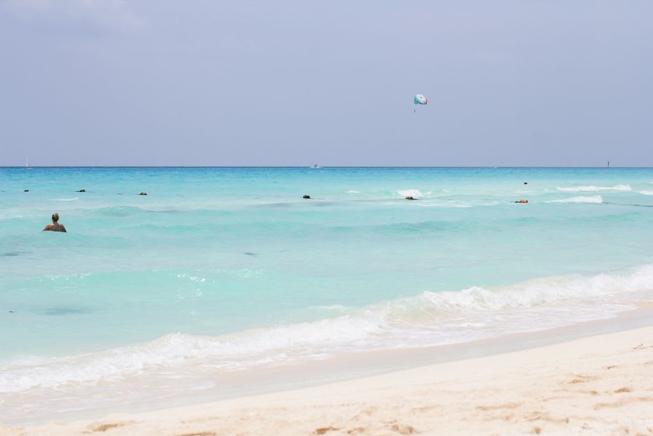 The Playa del Carmen waterfront in the early morning light, the Caribbean calm before the tourist crowds arrive.