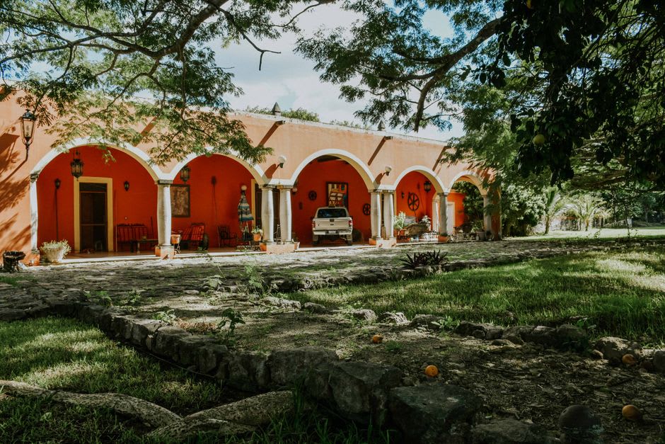 The grand stone entrance arch and main facade of a restored ex-hacienda on the outskirts of Salamanca, Guanajuato