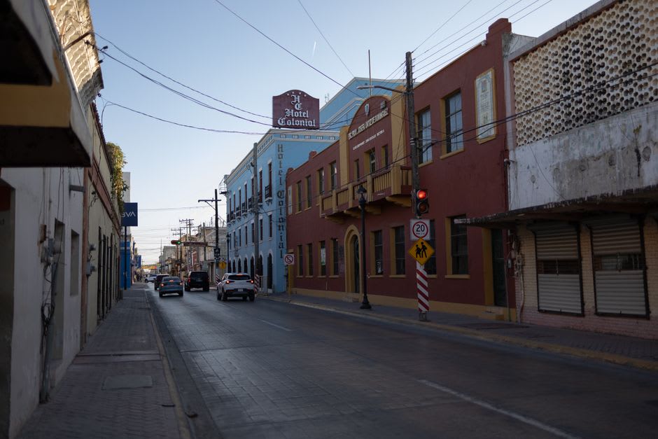 The quiet main plaza of San Fernando Tamaulipas on a winter afternoon with the church facade and empty benches