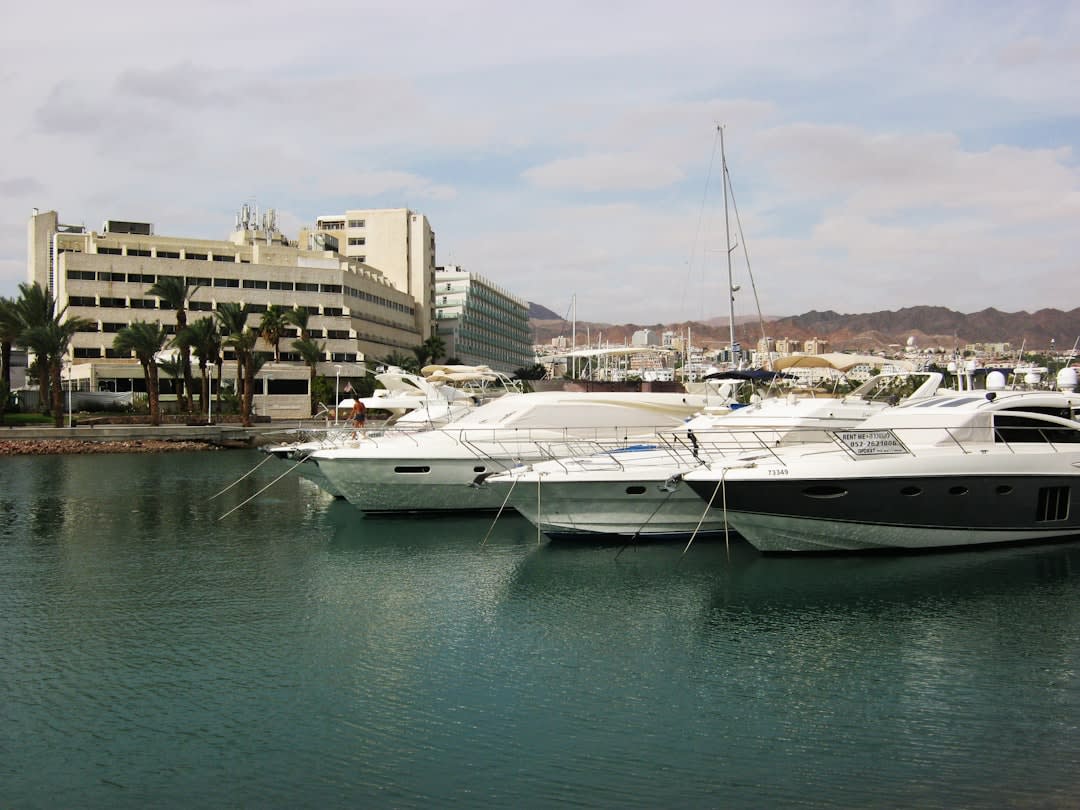 The quiet harbor at Santa Rosalía with fishing boats at rest and the red hills behind