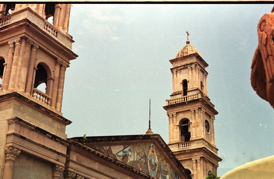 Art deco facade detail in Tampico centro with curved tile work and ornate upper-floor windows