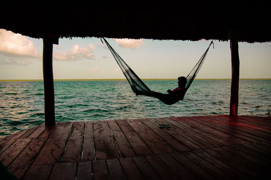 Warp threads for cotton hammocks stretched across a workshop in Tixkokob, Yucatán