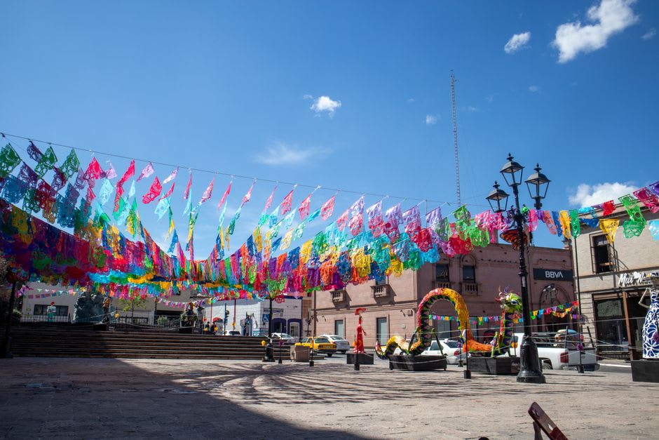 Interior of Mercado Alianza in Torreón, dried chiles and produce stalls under old wooden rafters