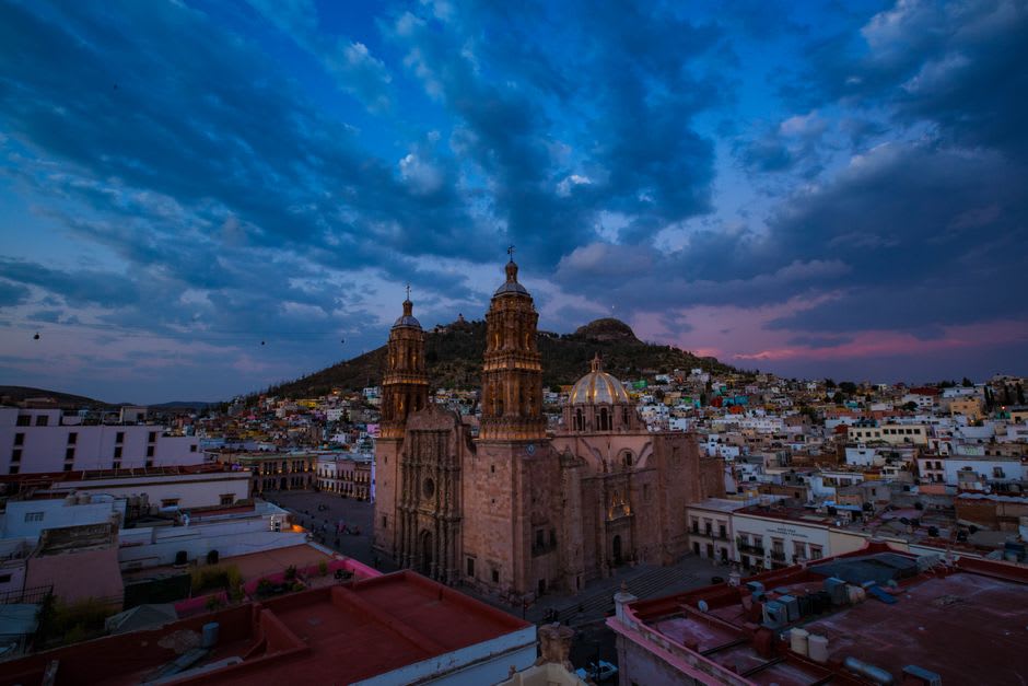 The view from Zacatecas' teleférico at dusk, the pink colonial city filling the narrow valley below