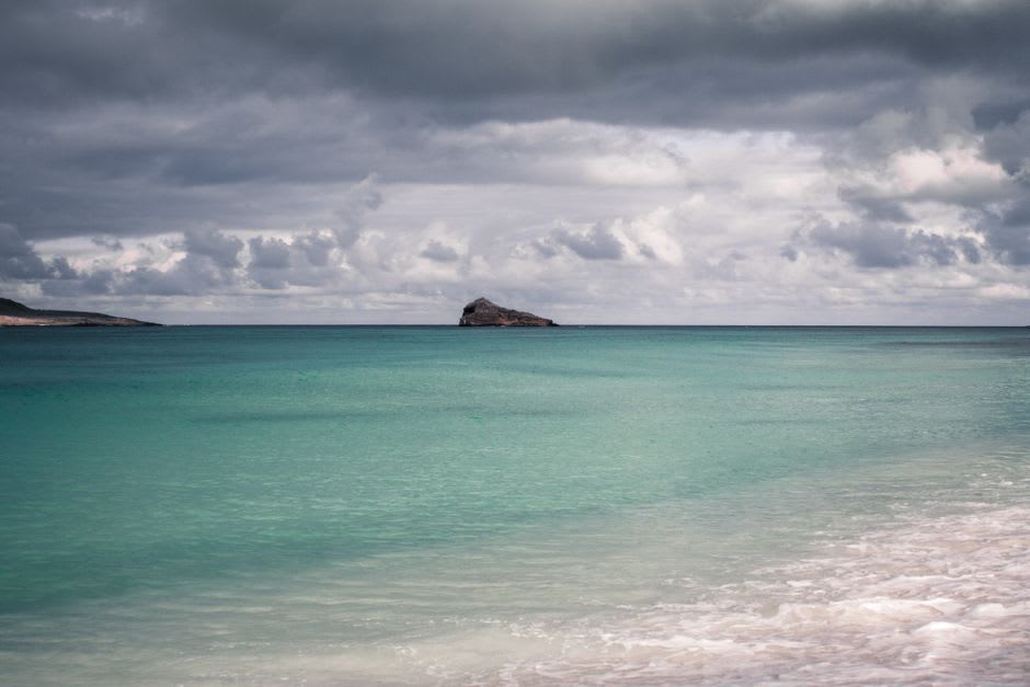 Calm turquoise water and white sand beach at Managaha Island off Saipan's western coast