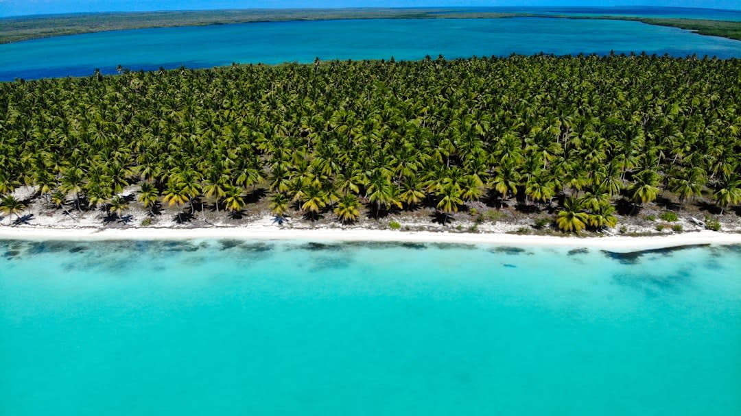 Aerial view of Ulithi Atoll's turquoise lagoon and thin sand islets stretching toward the horizon