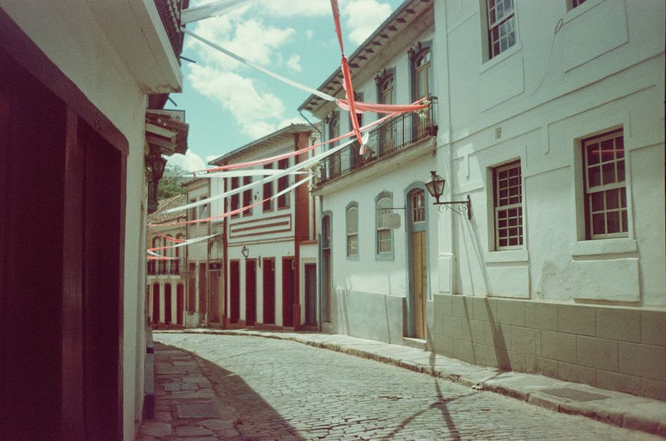 Weathered stone houses lining a cobbled street in São Thomé das Letras